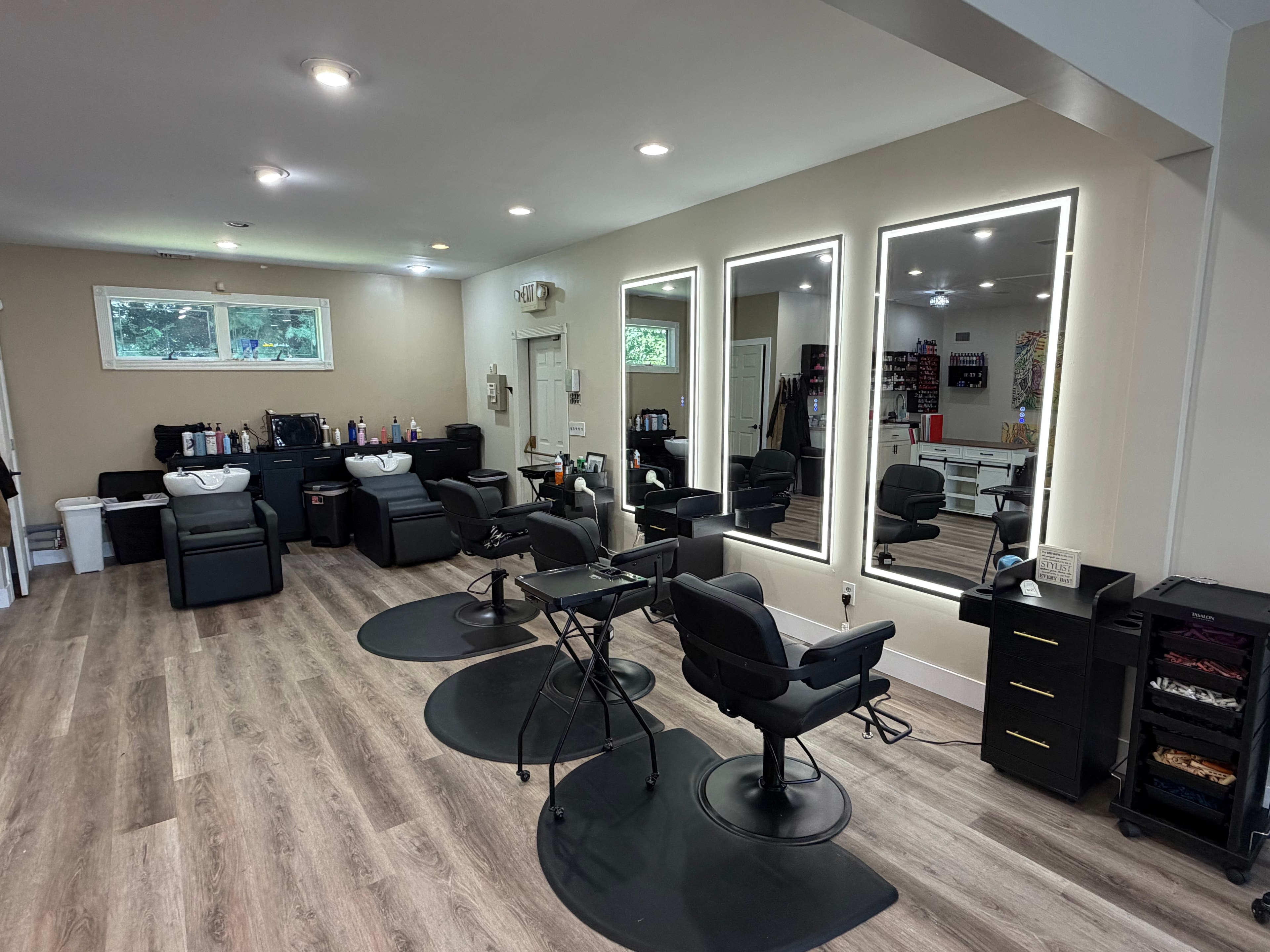 Hair by Sebo shampoo area with backlit rectangular mirrors